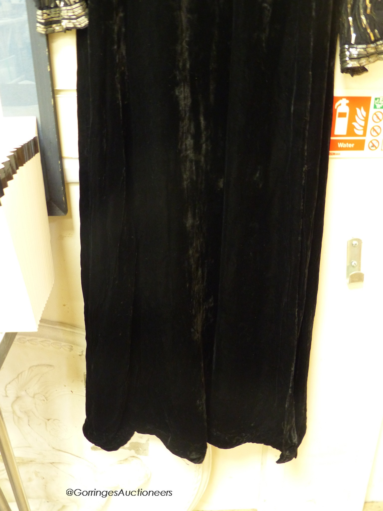 A late 1930's black silk velvet and silver evening dress and an Edwardian black sequin triangular shawl